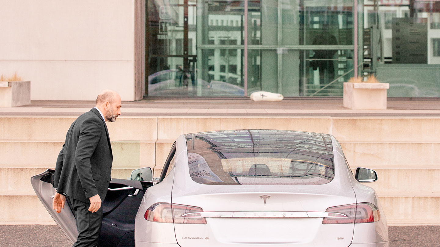 Businessman getting into a car